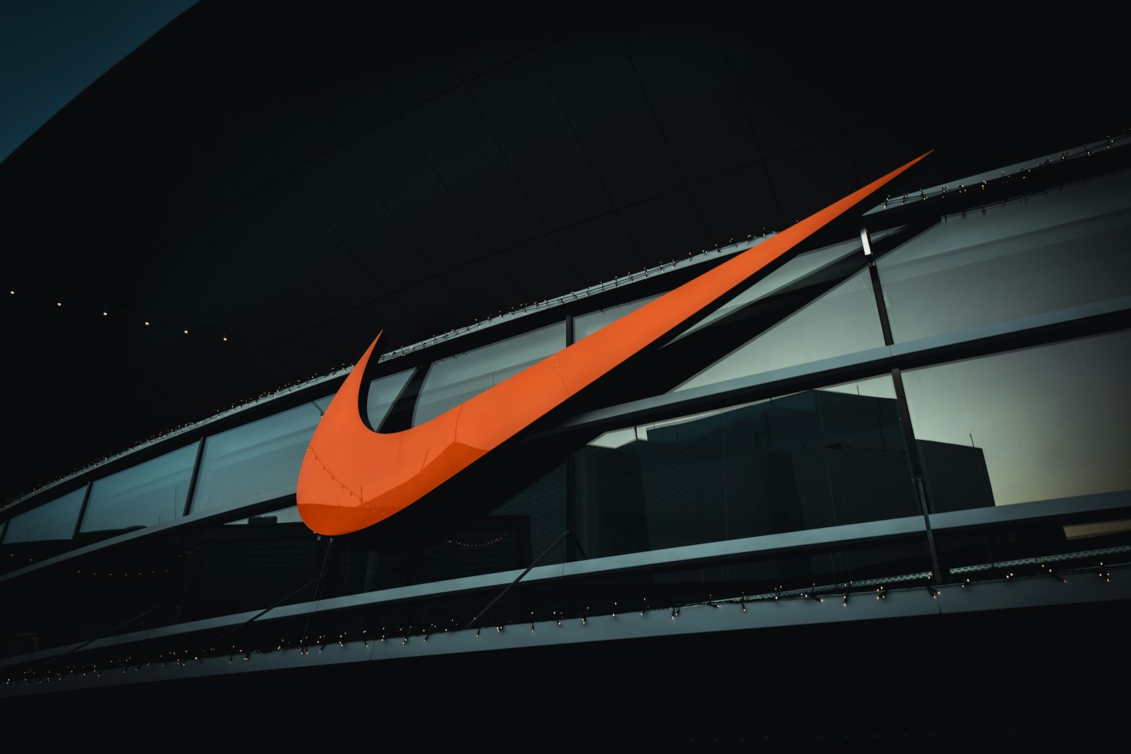 Large orange Nike Swoosh on the side of a building in Wolfsburg, Germany